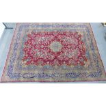 Kirman carpet / large rug, red field with central flowerhead medallion an an all-over foliate design