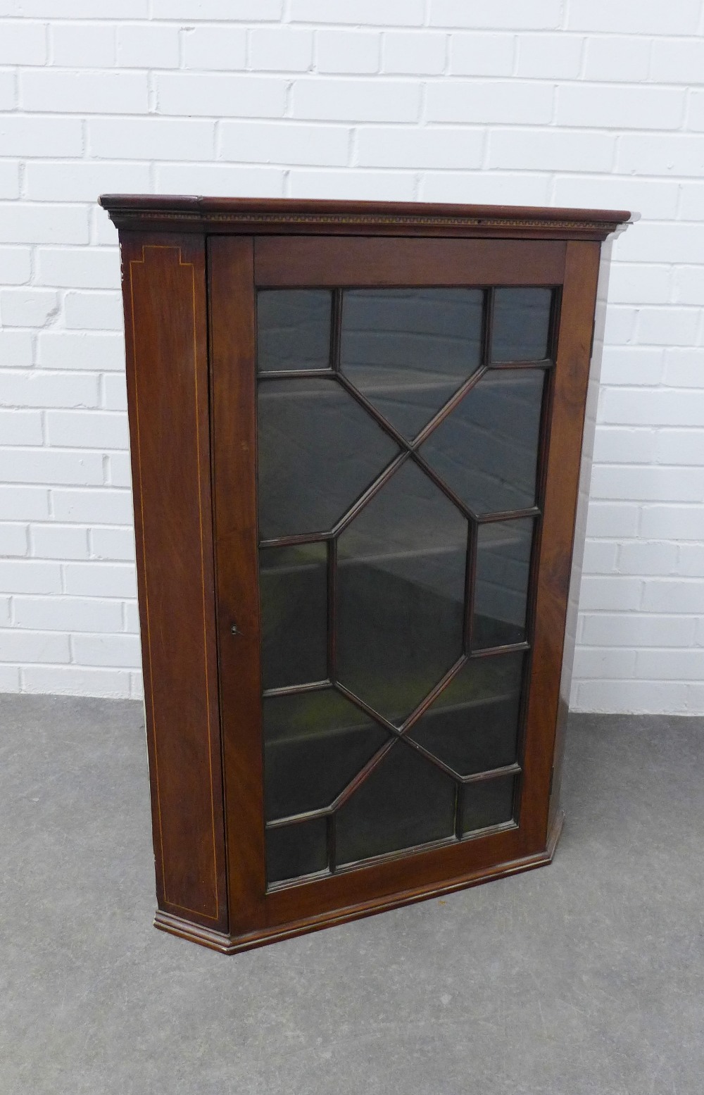 19th century mahogany and inlaid corner cupboard with astragal glazed door and shelved interior. 101