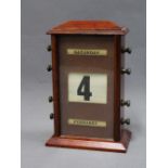 Mahogany cased perpetual desk calendar with glazed panel and operating nozzles on sides, 22cm