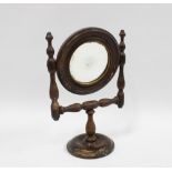 Miniature stained pine mirror, with circular plate and footrim, 28cm high