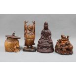 A wooden box and cover in the form of an Oriental man together with a fruitwood buddha and another