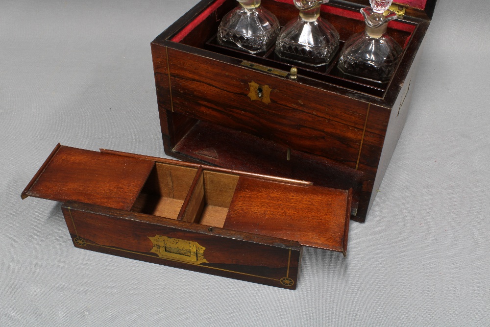 19th century rosewood and brass inlaid decanter box, the hinged lid opening to reveal a set of three - Image 3 of 4