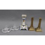 A collection of candlesticks to include a pair of Stuart Crystal, a pair of brass candlesticks
