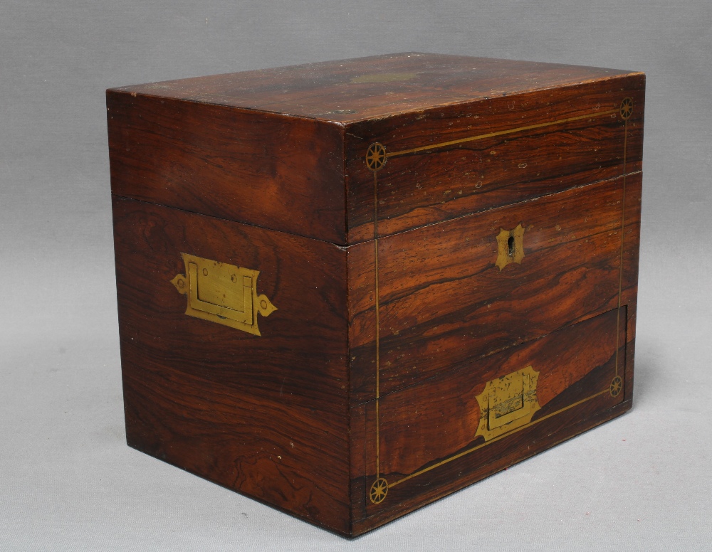 19th century rosewood and brass inlaid decanter box, the hinged lid opening to reveal a set of three
