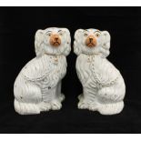 Pair of Staffordshire white glazed chimney spaniels, 22cm (2)