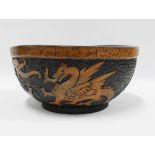 Early 20th century Dragon pokerwork fruit bowl, 30cm diameter