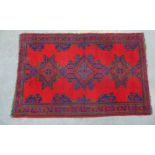 Turkish rug red filed and of typical design, 195 x 125cm