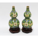 Pair of Chinese double gourd cloisonné vases with hardwood stands (2) 16cm high.