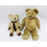 Two vintage blonde fur teddy bears, the smaller bear with a growler, 75cm & 60cm (2)