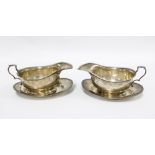 Pair of silver sauce boats with beaded rims together with matching plates, Birmingham 1927 (4)