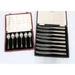 Cased set of six 'Hallmarks of the UK' silver teaspoons and a cased set of eight silver handled