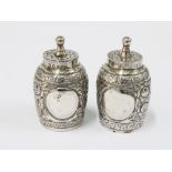 A pair of Victorian silver pepper pots, makers mark of Edward Hutton, London 1889, 5cm (2)