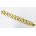 Gold bracelet with large rectangular textured links, clasp marked 372 M