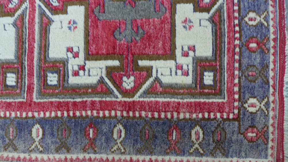 Caucasian rug, red field with three square panels enclosing stylised flowerheads, single border, 141 - Image 4 of 5