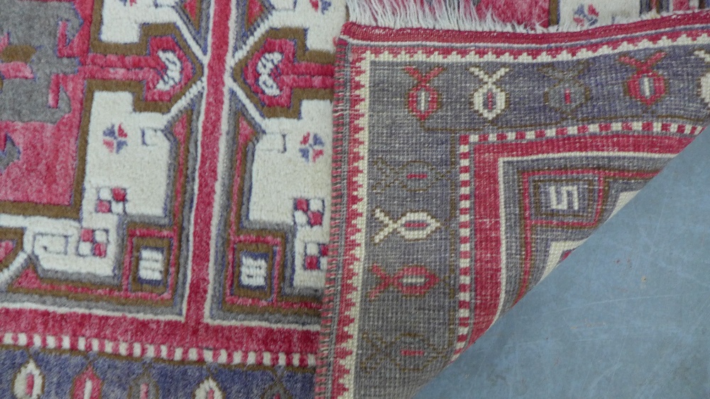 Caucasian rug, red field with three square panels enclosing stylised flowerheads, single border, 141 - Image 5 of 5