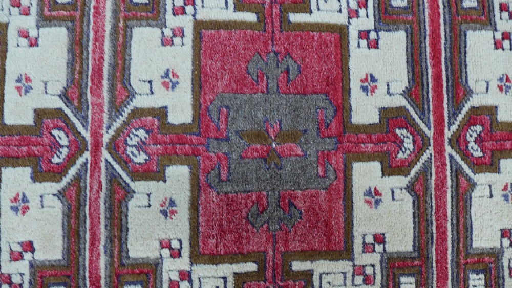 Caucasian rug, red field with three square panels enclosing stylised flowerheads, single border, 141 - Image 3 of 5