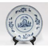 Delft blue and white charger, possibly London, with a village scene within a dash and dot border,