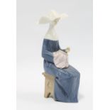 Lladro Time to Sew porcelain figure, 21cm.