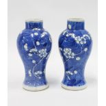 Pair of Chinese blue and white prunus pattern baluster vases (2) 15cm high.
