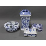 Collection of blue and white pottery to include two boxes, vase with posy cover and a egg stand (4)