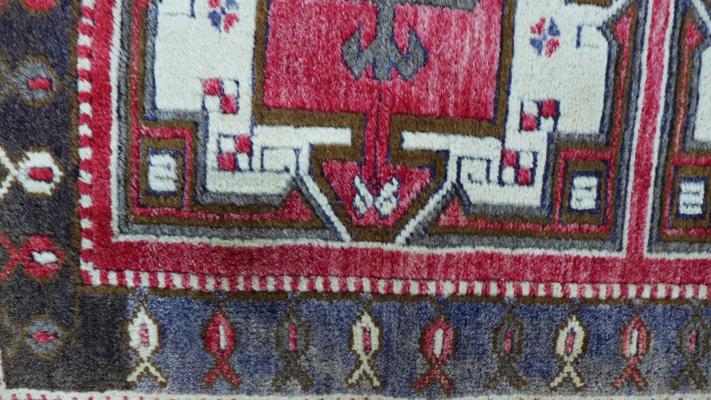 Caucasian rug, red field with three square panels enclosing stylised flowerheads, single border, 141 - Image 2 of 5