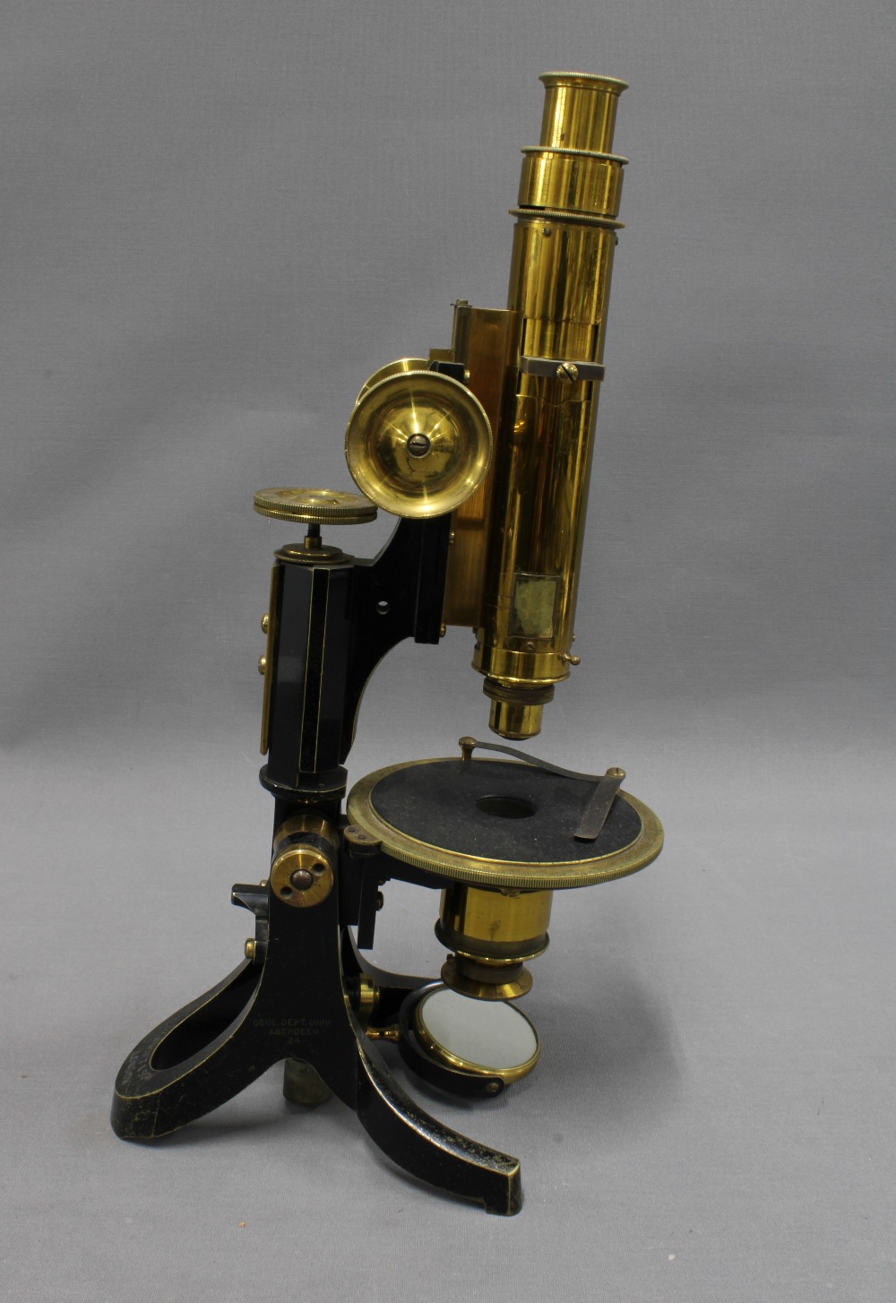 Swift & Sons petrological microscope, in black and brass, 36cm tall