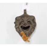 Greek stoneware mask head oil lamp, 13cm long