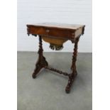 19th century rosewood sewing table, the serpentine top with a lift up section, opening to reveal a