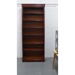 Modern mahogany bookcase, of tall proportions, the cornice top over six shelves with reeded edges,