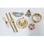A collection of costume jewellery to include a gold plated bangle, paste necklaces and lady's