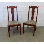 Pair of walnut side chairs with vasiform splats and slip in seats. 102 x 46 x 47. (2)