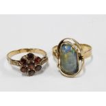 9ct gold opal dress ring and a 9ct gold garnet flowerhead ring (2)