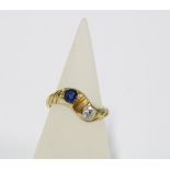 15ct gold diamond and sapphire crossover ring, stamped 585