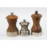 Two silver mounted pepper grinders, one with London 2004 hallmarks and the other Birmingham 1979,