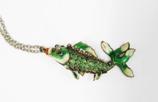 An articulated white metal and coloured enamel fish pendant on chain, 5.5cm