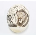 Ostrich egg painted with a lion and a zebra, signed Roger, approx. 18cm high