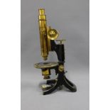 Swift & Sons petrological microscope, in black and brass, 36cm tall