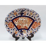 Imari oval dish with frilled edge and typical pattern of birds, rockwork and chrysanthemums,