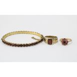 Two 9ct gold garnet dress rings and a garnet bracelet (3)