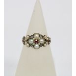 19th century ruby, pearl and diamond mourning ring with a flowerhead setting of four pearls and four