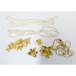 Singapore Orchids gold plated jewellery to include a necklace, brooch and earrings and three strands