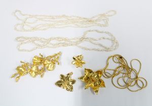 Singapore Orchids gold plated jewellery to include a necklace, brooch and earrings and three strands