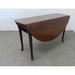 19th century mahogany drop leaf table on tapering legs with pad feet, (71 x 128 open, and 71 x