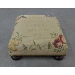 Small tapestry footstool on bun feet. 17 x 34 x 34cm.