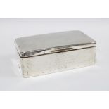 Early 20th century silver table cigarette box, cedar lined and with engraved inscription, 18cm long