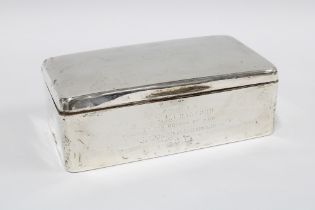 Early 20th century silver table cigarette box, cedar lined and with engraved inscription, 18cm long