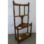 An Art Nouveau oak hall stand with original drip trays, 201 x 94 x 33cm.