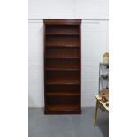 Modern mahogany bookcase, of tall proportions, the cornice top over six shelves with reeded edges,