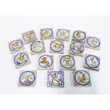 Set of twenty three small tin glazed tiles, 7cm square (23)