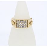 18ct gold and diamond plaque ring set with nine diamonds, inner band stamped 18k
